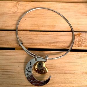 Dangle bracelet with moon and heart.